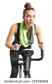 Girl Exercising On Exercise Bike