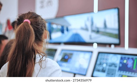 Girl experiencing interactive simulation at a technology exhibition