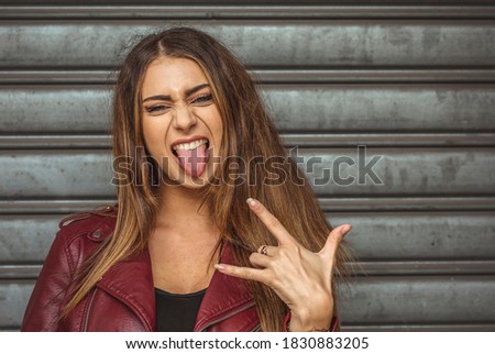 Girl expression with tongue, griely grimace.
