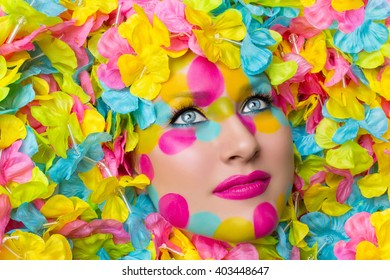 Girl face in flower petals