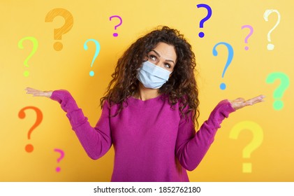 Girl With Face Mask Has A Lot Of Question About Covid 19. Yellow Background