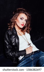 Girl In Fancy Leather Jacket Pitchman Style On A Black Background