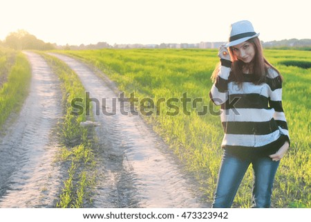 girl fashion in the field on sunset