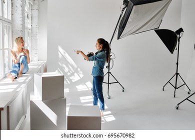 Girl Fashion Photographer Works In The Studio