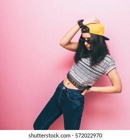 Girl In Fashion Pose In Cap And Crop Top. Style Of 90s. Pastel Palette