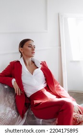 Girl in a fashionable color combination of clothes. Total red. Natural colors. Natural female beauty. Advertisement or clothes sale design. - Shutterstock ID 2204175895