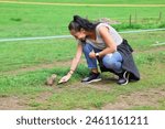 A girl feeding a groundhog at Luka plna syslov