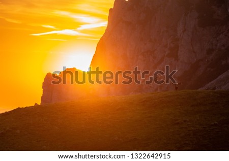 Girl/ female is looking on sunset in mountains and enjoy life, freedom, hiking and traveling in wild nature, beautiful background image, scenery from vacation,  Big Rozsutec, Small Fatra, Slovakia