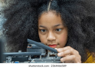 Girl female teen children concentrate enjoy Machine Learning Robot is Moving Under Control robot coding at technology stem class, stem education robot for digital automation artificial intelligence ai - Shutterstock ID 2364466589