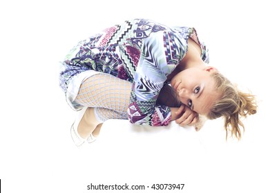 Girl In The Fetal Position. On A White Background