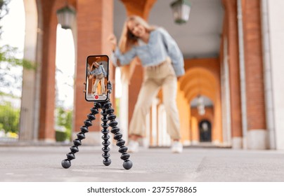 Girl filming video of herself, creating content for social media - Shutterstock ID 2375578865