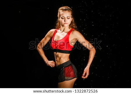 Similar – One young middle age athletic, woman training, exercising with fitness jumping rope over dark background, full length front view, looking at camera