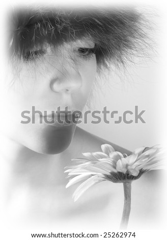 Young blonde woman posing with a huge daisy