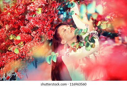 girl in a flowering bush