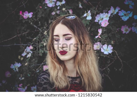 Similar – Young redhead woman surrounded by plants