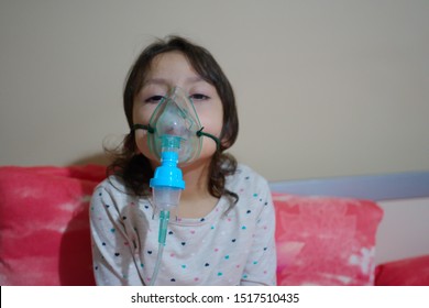 the girl with the flu, upper respiratory infection. being treated with nebulizer. virus, epidemic and infectious disease treatment