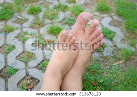 Girl foot and his father foot