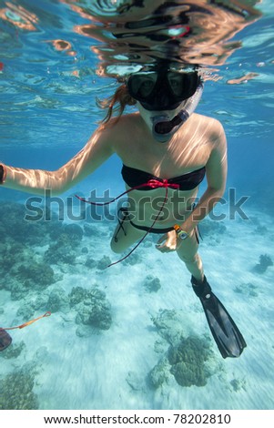 Girl free diving in the ocean, Andaman Sea, Thailand.