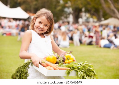 Girl With Fresh Produce Bought At Outdoor Farmers Market - Powered by Shutterstock