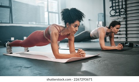 Girl friends, plank and gym fitness of women doing exercise, workout and body wellness. Motivation, woman focus and challenge of people in sports training and athlete class exercising for health - Shutterstock ID 2267293671