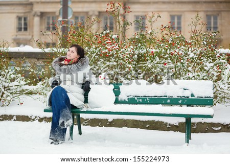 Girl with a funny little snowman