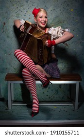 girl funny playing the accordion