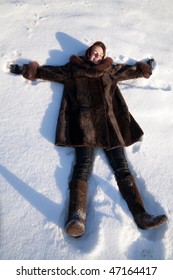 Girl In  Fur Coat  Making Snow Angels