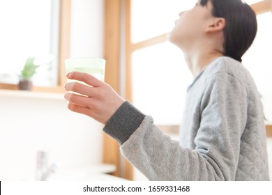 Girl Gargling Throat At Home 