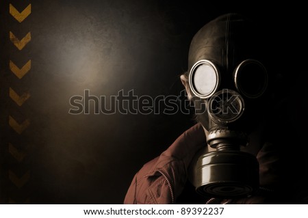 Girl with gas mask in a grunge background