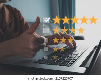 The girl gave the thumbs up to rate satisfaction. stay at five stars Top Rated, Shop Rating, Shop Review, Shopping - Shutterstock ID 2137223907