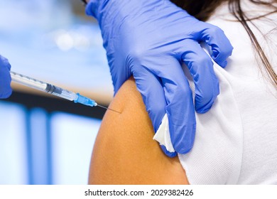 Girl getting the Covid19 vaccine, Pfizer, AstraZeneca or Moderna.