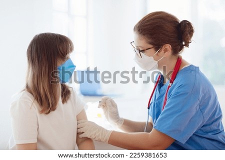 Girl getting vaccine. HPV vaccination for young girls. Doctor giving teen kid patient shot. Immunization program for adolescents and children. Health care. Teenager at pediatrician.