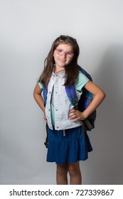 A Girl With Glasses Is Excited And Nervous For Her First Day Of School.
