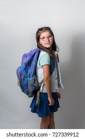 A Girl With Glasses Is Excited And Nervous For Her First Day Of School.
