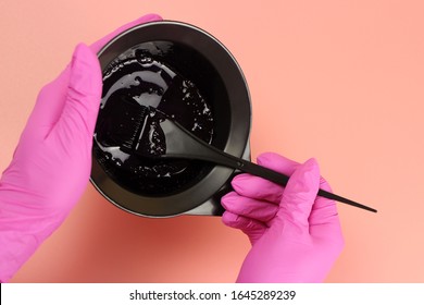 Girl In Gloves Mixes Hair Dye In A Bowl