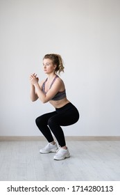 Girl Goes In For Sports At Home. Beautiful Fitness Figure. The Sexual Body Of A Young Woman. Squat Exercises For The Legs.