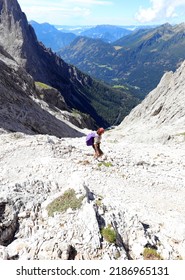 Girl Going Down The Mountain Path To Reach The South Tyrol Valley In Northern Italy