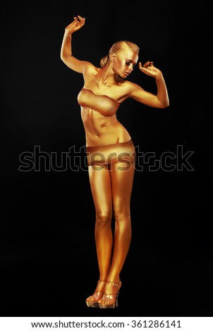 Girl with golden skin. Full-length.