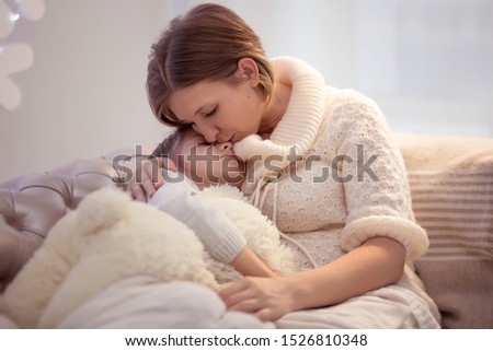 Similar – Newborn baby girl sleeping lying on blanket with her mother