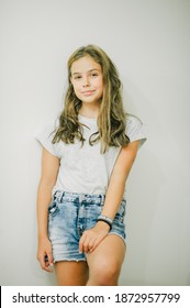 Girl In A Gray T-shirt And Jeans. Girl 10-11 Years Old