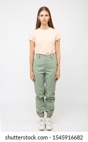 Girl In Green Cargo Pants And A T-shirt