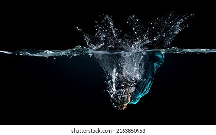 Girl in green dress under water - Powered by Shutterstock