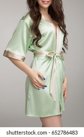 Girl In Green Silk Robe, On Gray Background