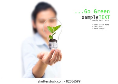 Girl and green tree light bulbs, Symbol of go green concept
