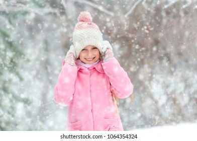 Girl grinning happily in the forest - Shutterstock ID 1064354324