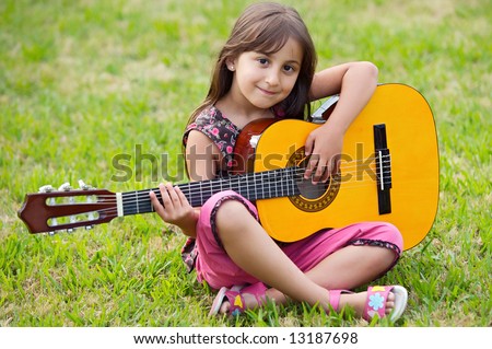 Similar – Image, Stock Photo Girl with a guitar in the green grass