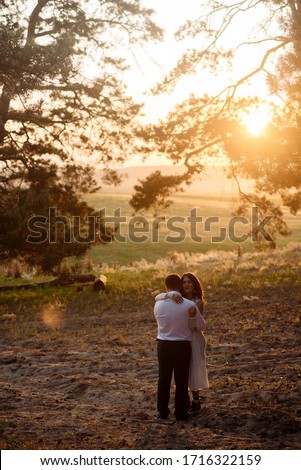 Similar – Image, Stock Photo Couple kissing on the field