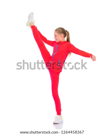 A girl gymnast performs an acrobatic element. The concept of childhood, sport, healthy lifestyle. Isolated on white background.