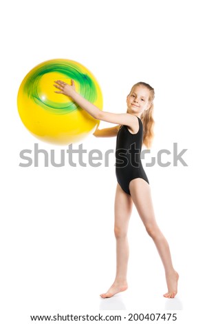 girl gymnast with a yellow ball