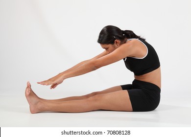 Girl In Hamstring Stretch To Touch Toes